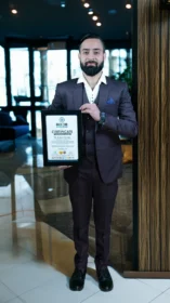Dr Gaurav Saxena holding Bharat Book of World Records 2025 certificate Bharat Excellence Award India
