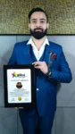 Dr Gaurav Saxena holding Global International Achievers Award 2025 certificate for excellence in astrology and spiritual leadership