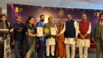 Dr Gaurav Saxsena receiving Global Excellence Award 2026 at Mantrachitra Spiritual Healing Council event New Delhi