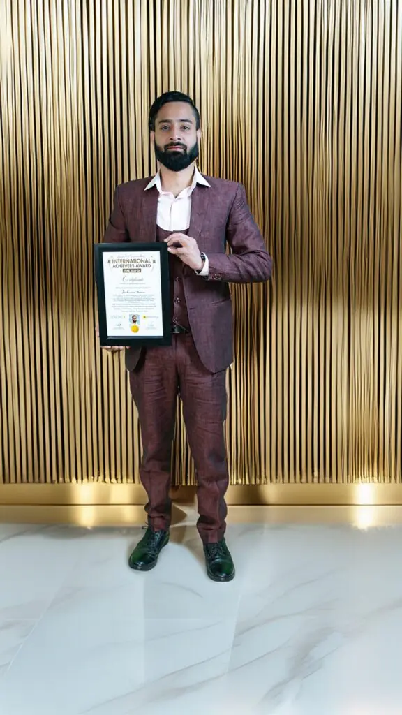 Dr Gaurav Saxena holding International Achievers Award 2025 certificate for excellence in astrology numerology vastu spiritual leadership