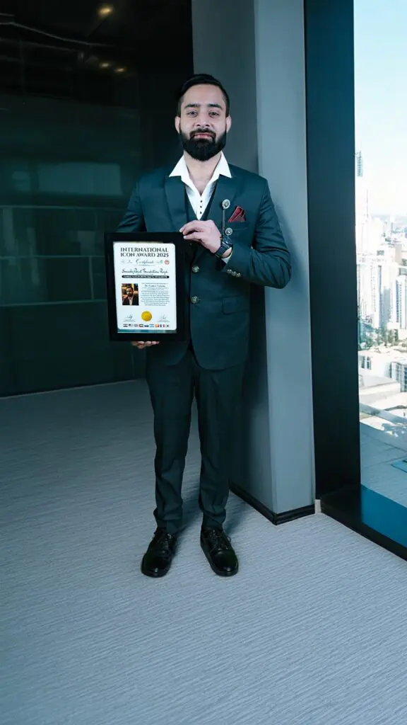 Dr Gaurav Saxena holding International Icon Award 2025 certificate for excellence in astrology and spiritual leadership