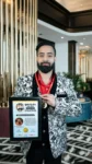 Dr Gaurav Saxena holding Subhash Chandra Bose National Award 2025 certificate and medal for excellence in astrology and spiritual leadership